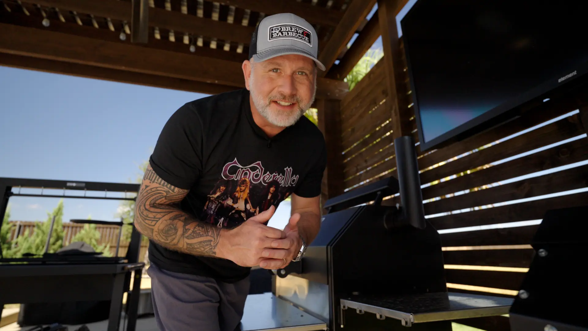 Ty Sherrell of TX Brew & Barbecue in his backyard by the smoker